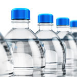 Row of plastic drink water bottles
